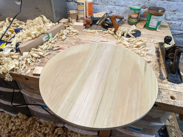 The largest of my tarte Tatin pans is 18", so I have cut out a ~21" circle and tapered the edges from the circle you can see drawn on the underside
